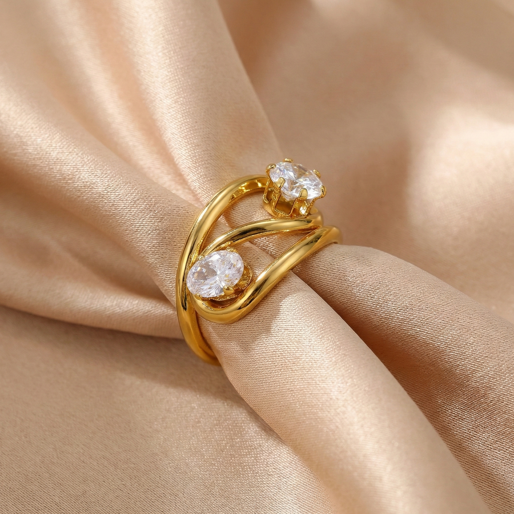 Anillo abierto de circonitas en acero dorado
