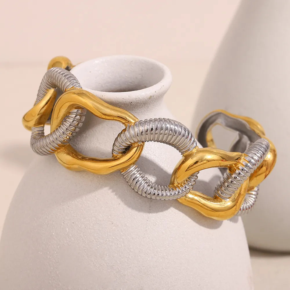 Pulsera de eslabones bicolor en acero dorado