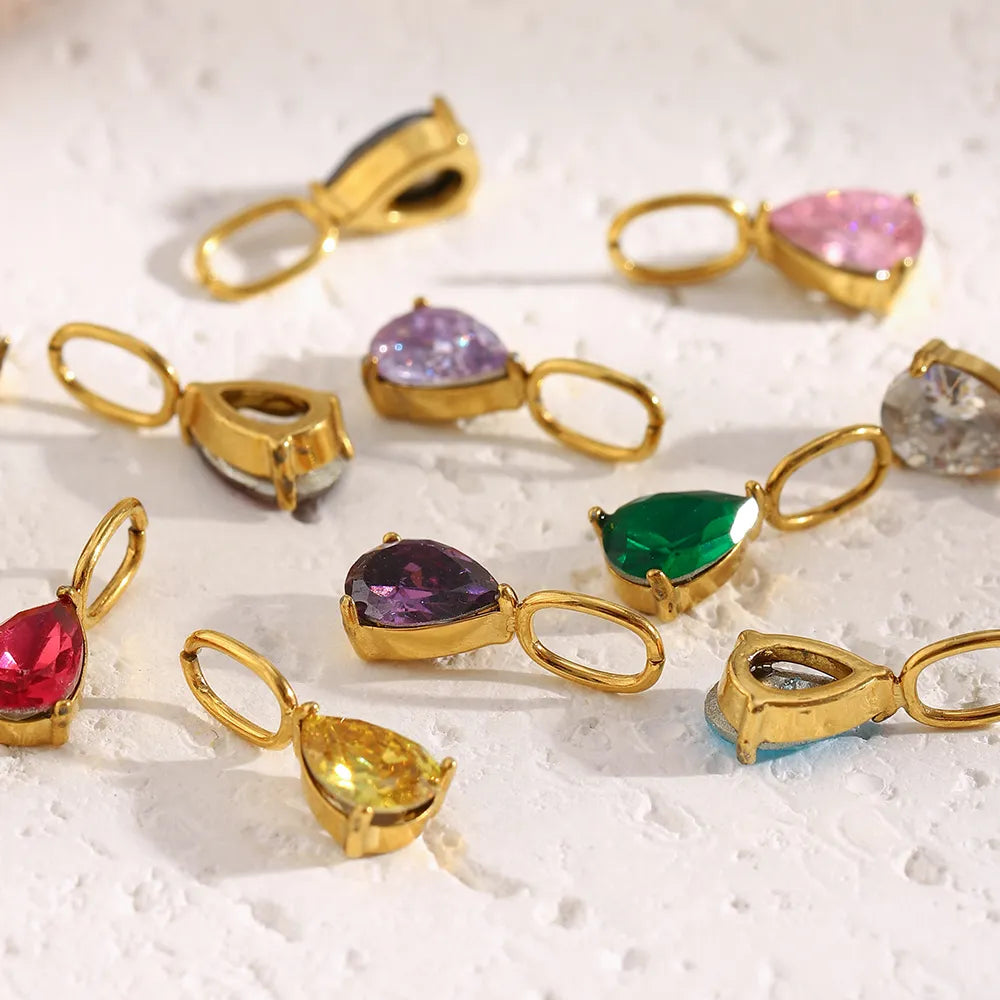 Charm de gota de circonita en acero dorado