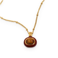 Collar con colgante de piedra efecto ojo de tigre en acero dorado
