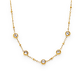 Collar con engaste en bisel de circonitas en acero dorado