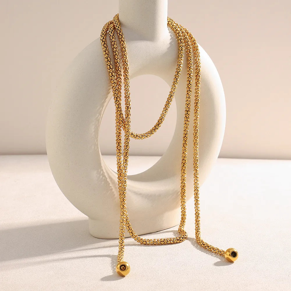 Collar lariat en acero dorado