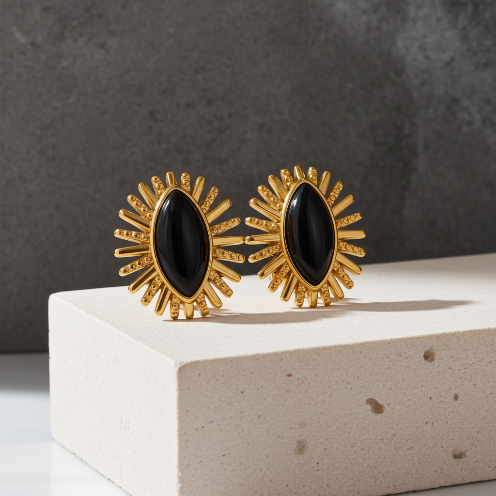 Pendientes de rayos de ágata negra en acero dorado