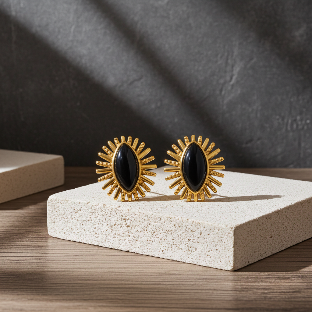 Pendientes de rayos de ágata negra en acero dorado