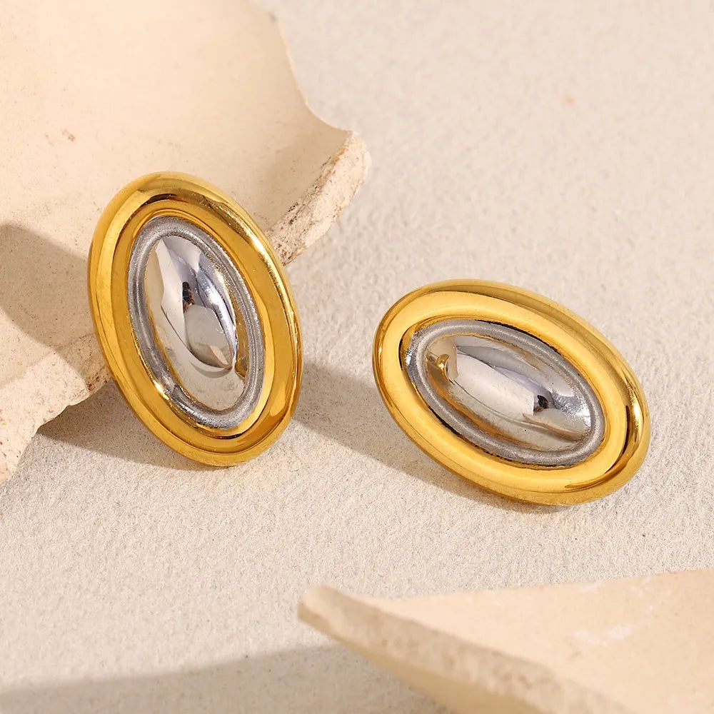 Pendientes ovalados bicolor en acero dorado
