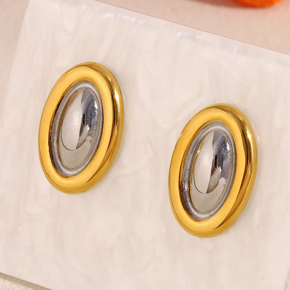 Pendientes ovalados bicolor en acero dorado