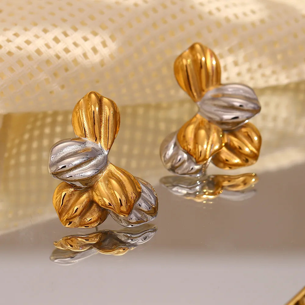 Pendientes de hojas bicolor en acero dorado