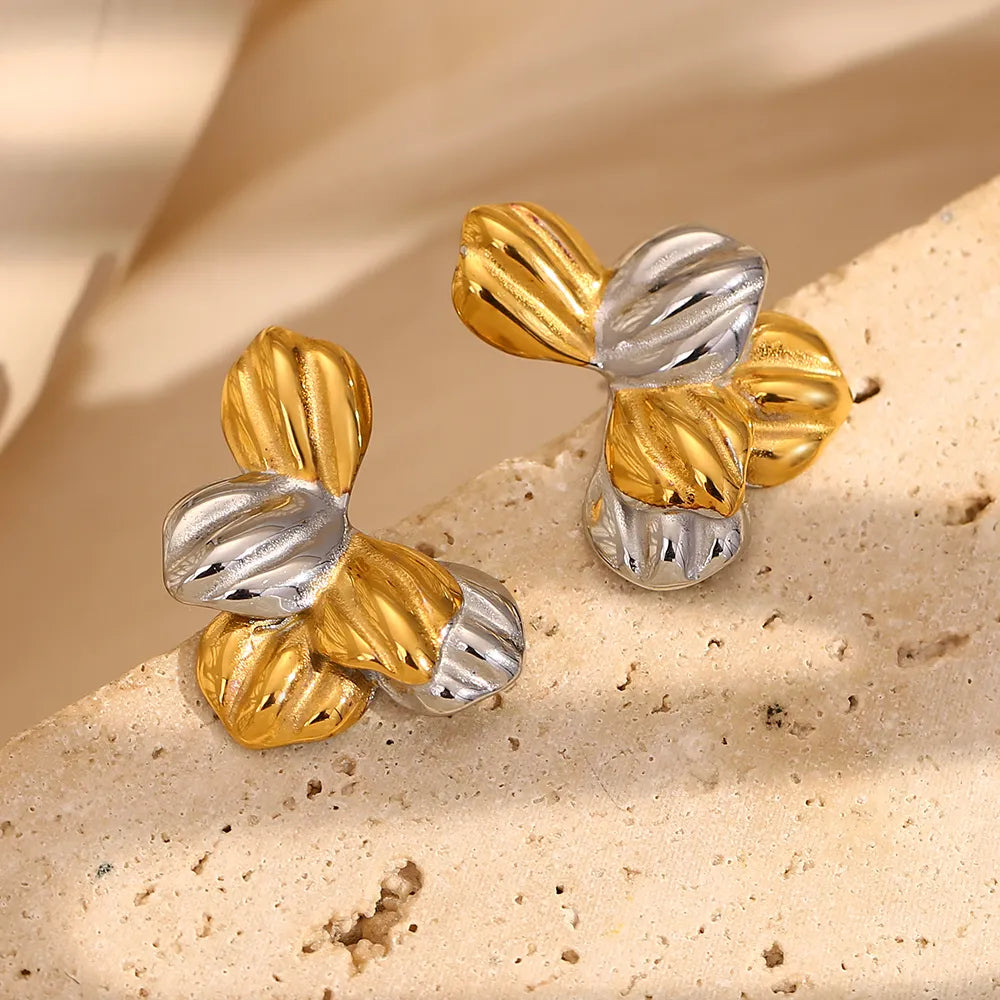 Pendientes de hojas bicolor en acero dorado