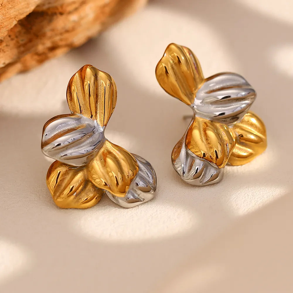 Pendientes de hojas bicolor en acero dorado