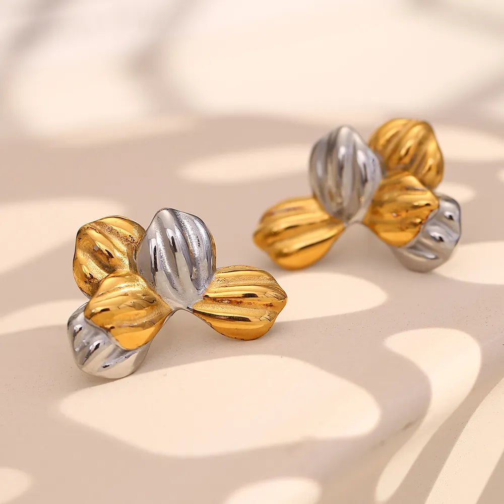 Pendientes de hojas bicolor en acero dorado
