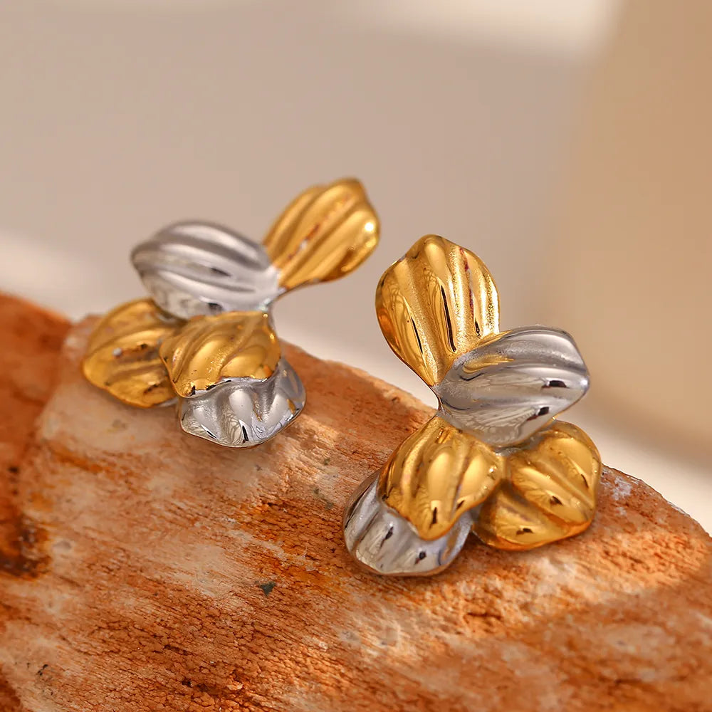 Pendientes de hojas bicolor en acero dorado