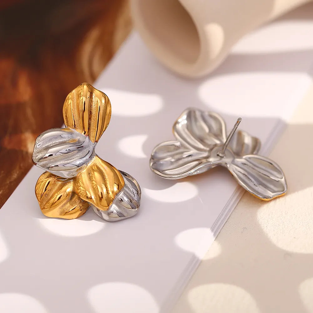 Pendientes de hojas bicolor en acero dorado