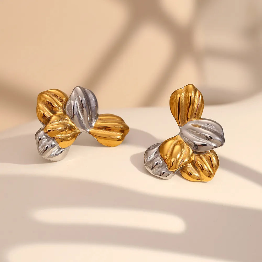 Pendientes de hojas bicolor en acero dorado