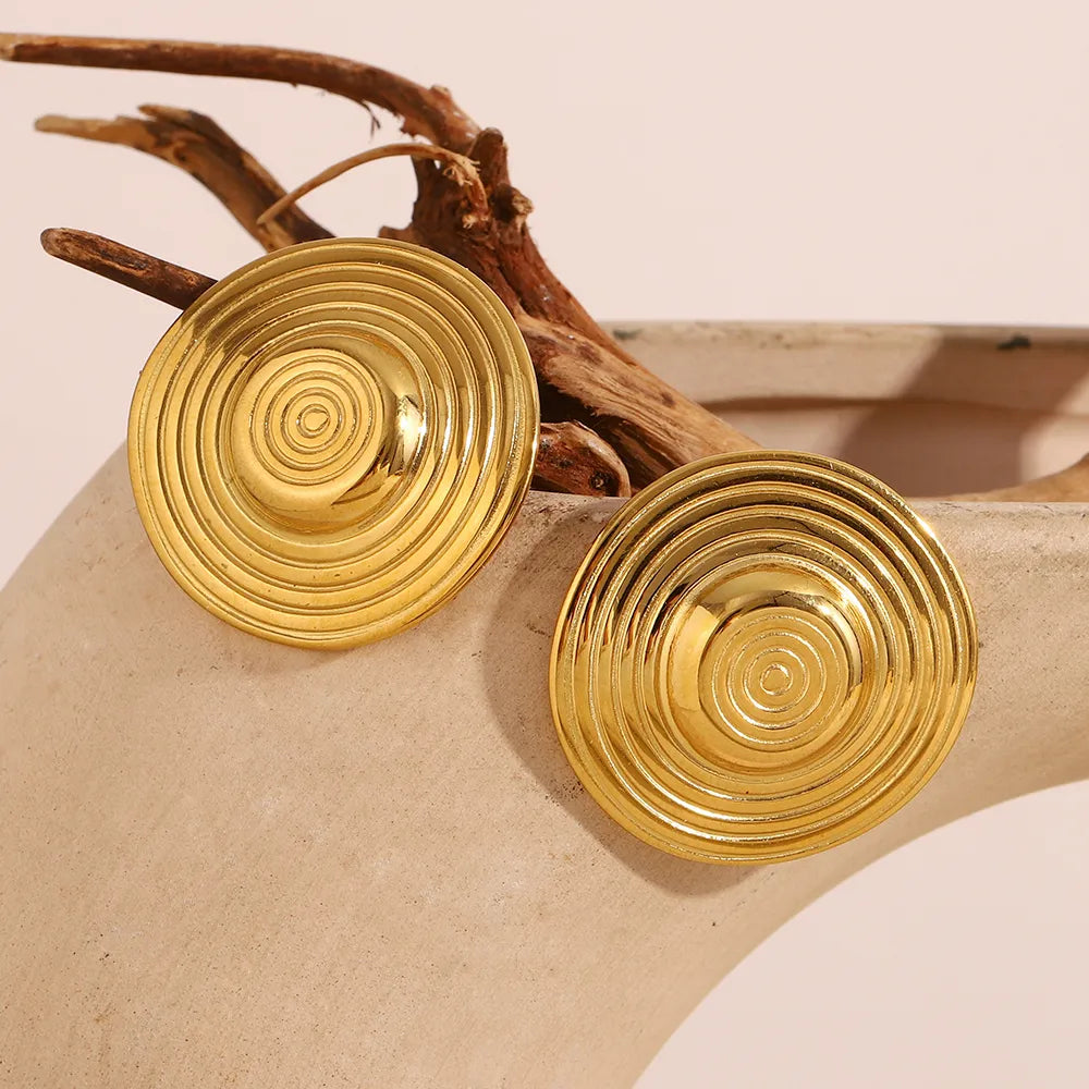 Pendientes de círculos concéntricos en acero dorado