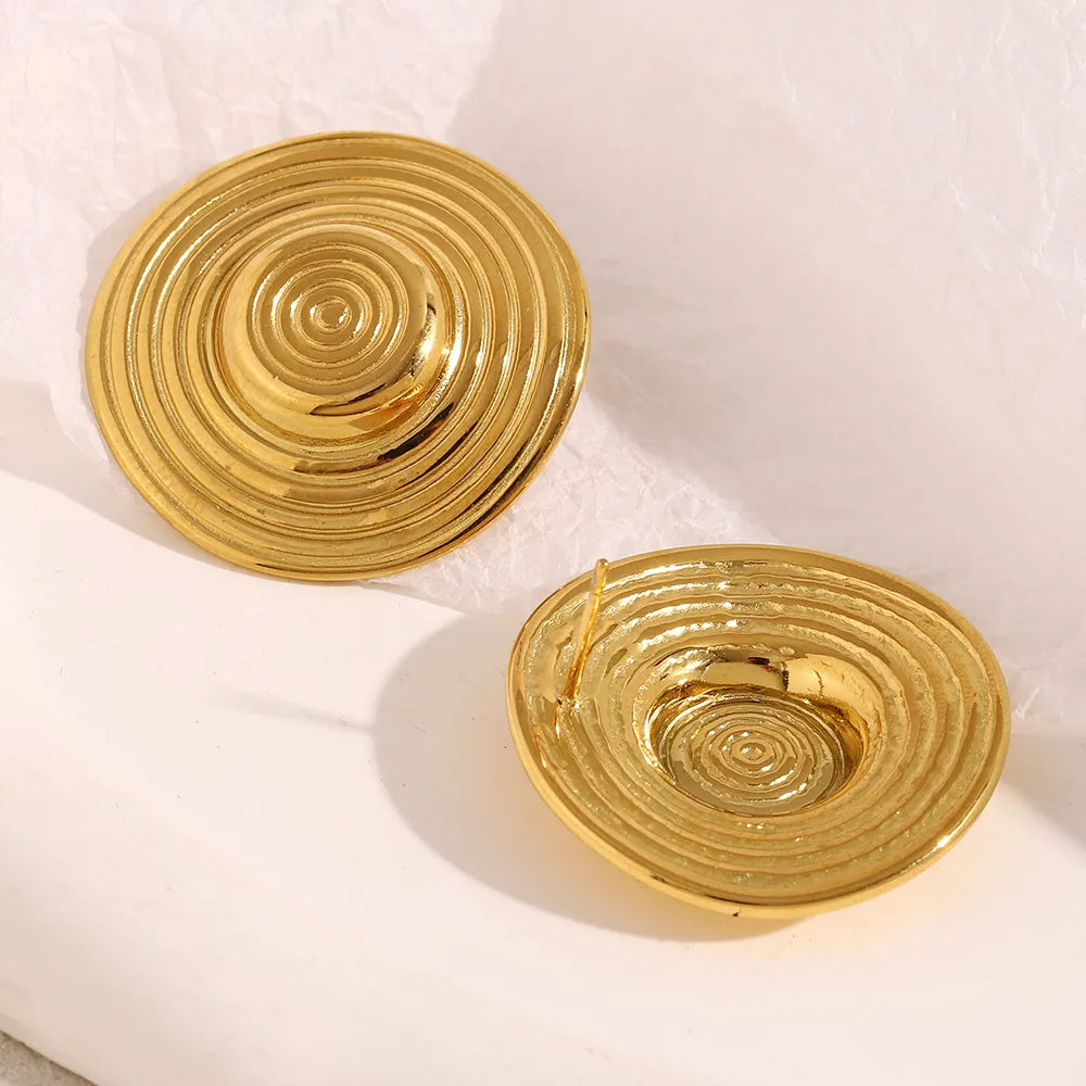 Pendientes de círculos concéntricos en acero dorado