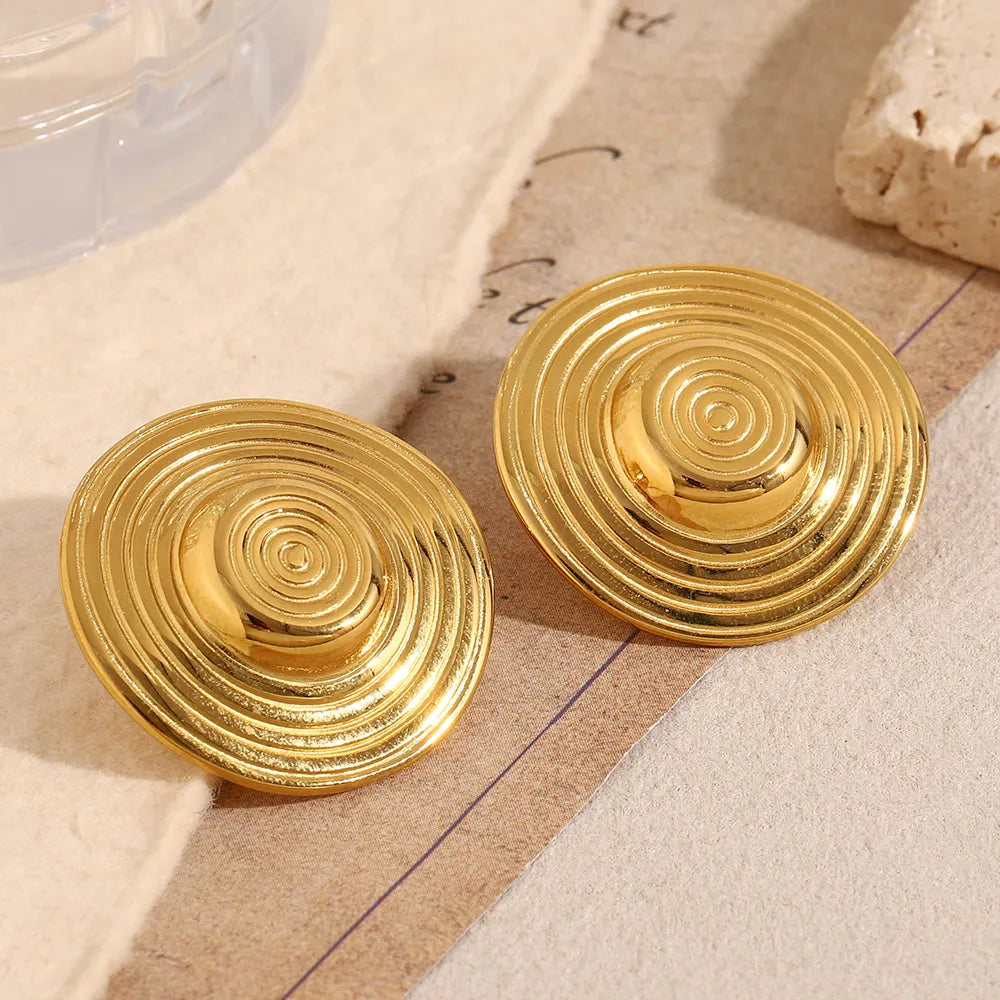 Pendientes de círculos concéntricos en acero dorado