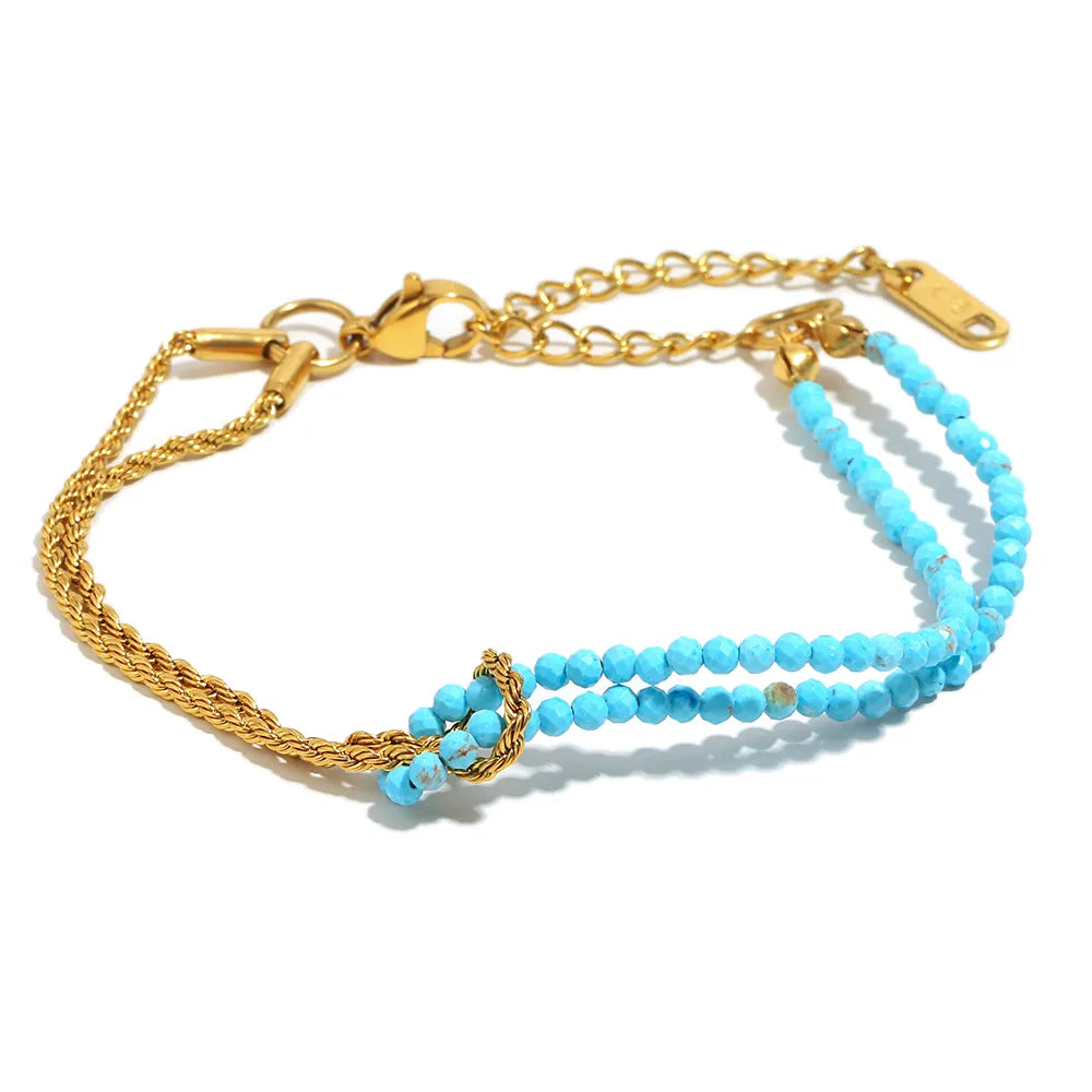 Pulsera de doble hilera de cuentas turquesas en acero dorado