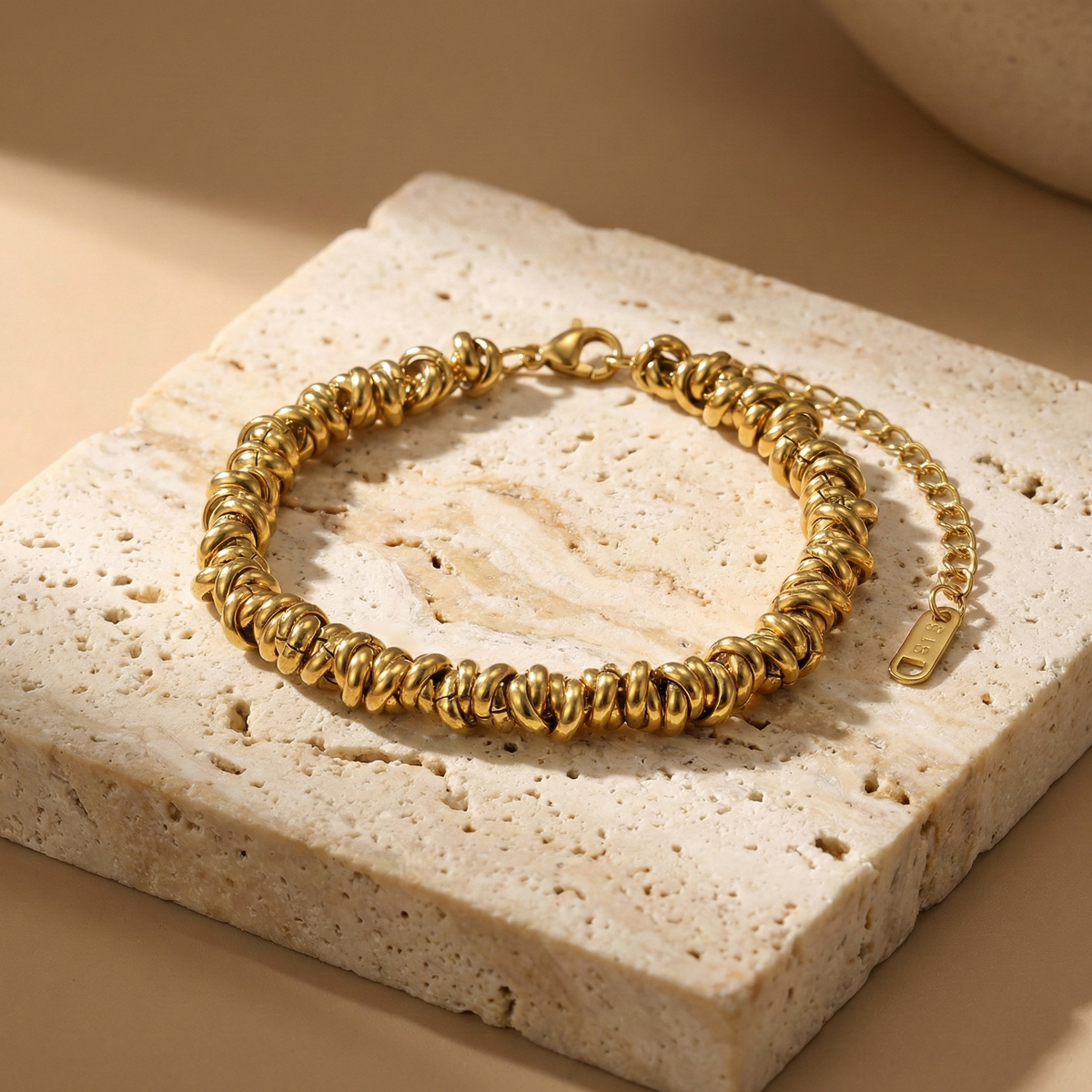 Pulsera de aros en acero dorado