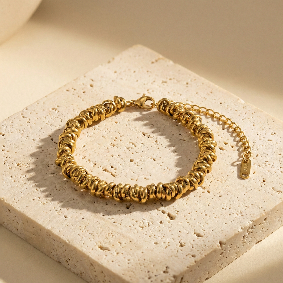 Pulsera de aros en acero dorado