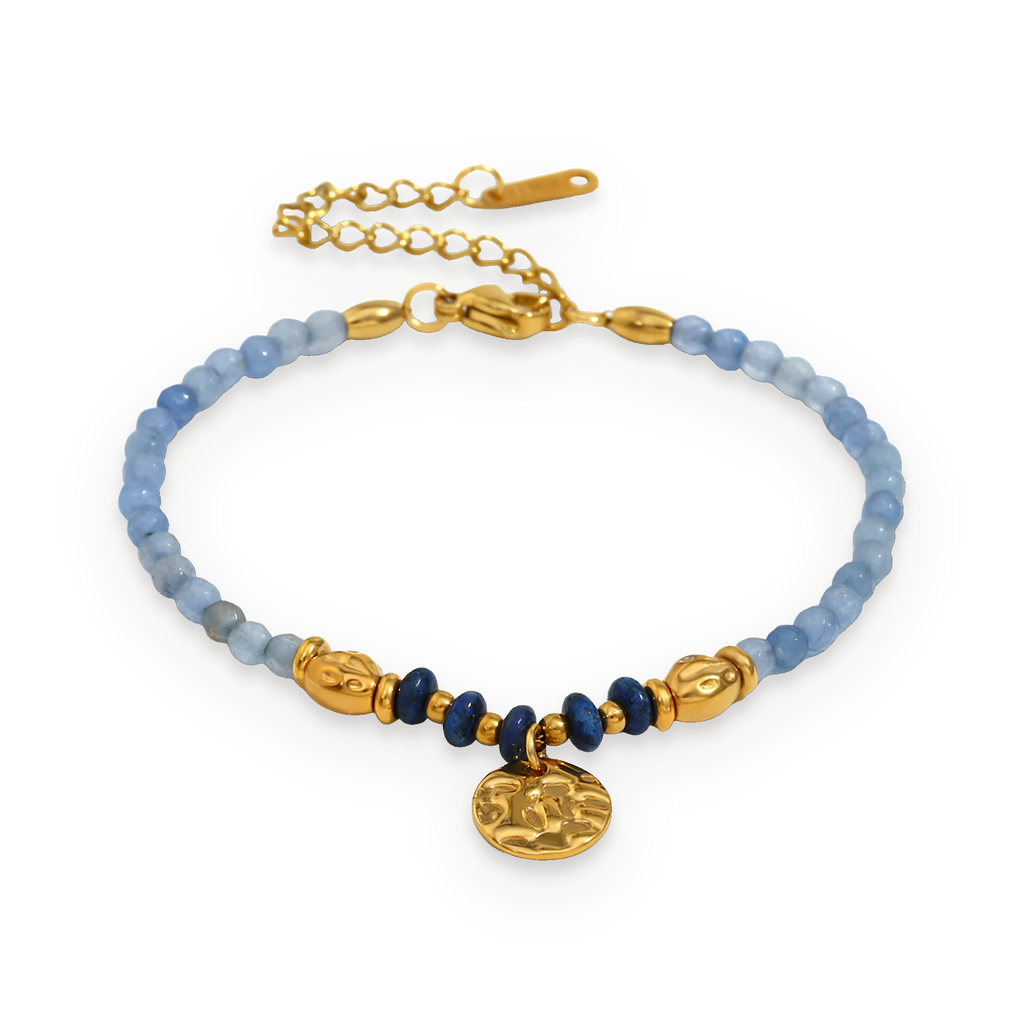 Pulsera de cuentas de piedras azules en acero dorado