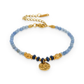 Pulsera de cuentas de piedras azules en acero dorado