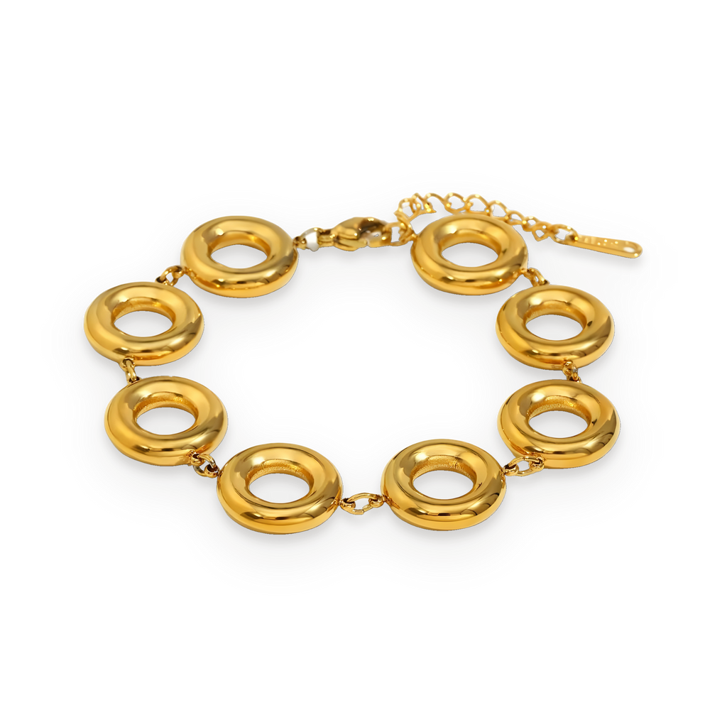 Pulsera de círculos pulidos en acero dorado